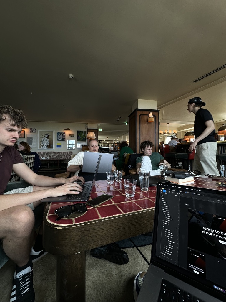 the team working on laptops around a cafe table