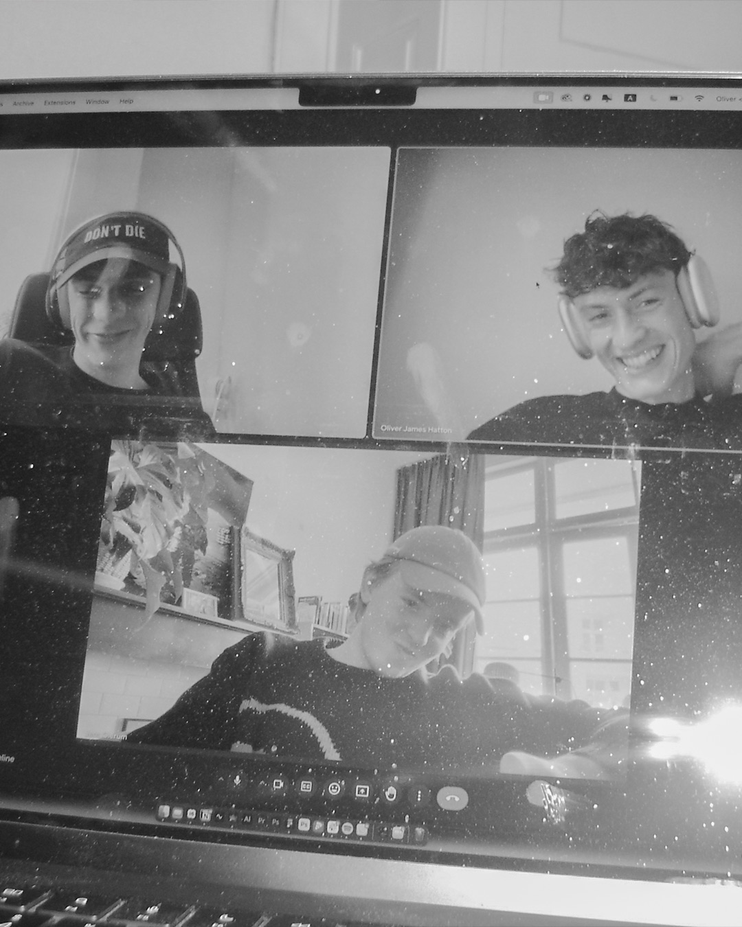 a black-and-white photograph of a three-person video call
